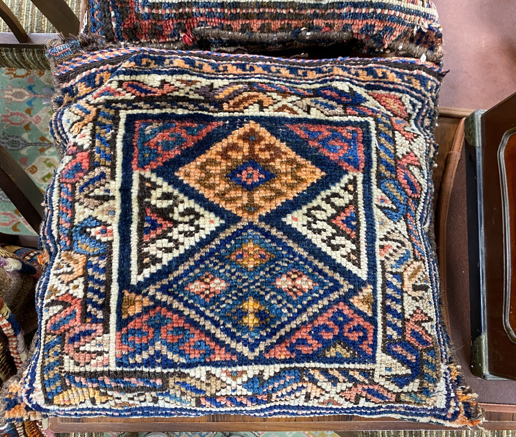 Three Persian salt bags made into cushions